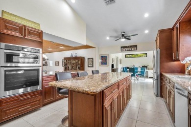 Nestled in the prestigious Boca Woods Country Club, meticulously on Boca Woods Country Club in Florida - for sale on GolfHomes.com, golf home, golf lot