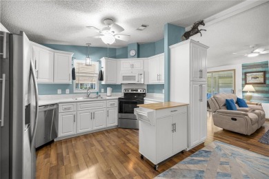 Welcome to this lovely two-bedroom, two-bath home located in the on Orange Blossom Hills Golf and Country Club in Florida - for sale on GolfHomes.com, golf home, golf lot