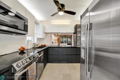 Largest corner unit available in The Lakes of Environ, offering on Inverrary Country Club in Florida - for sale on GolfHomes.com, golf home, golf lot