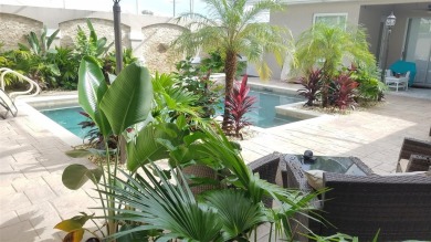 Tropical Cabana-Style Retreat in Sought-After Golf Course on Silverthorn Country Club in Florida - for sale on GolfHomes.com, golf home, golf lot