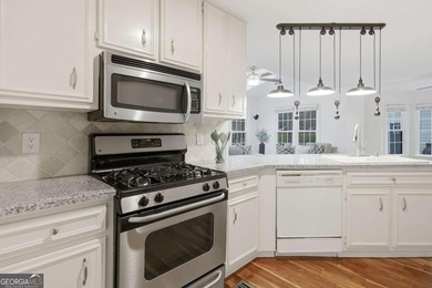 Welcome to 618 Wedgewood Drive, a refined golf-course residence on Canongate At Eagle Watch Golf Club in Georgia - for sale on GolfHomes.com, golf home, golf lot