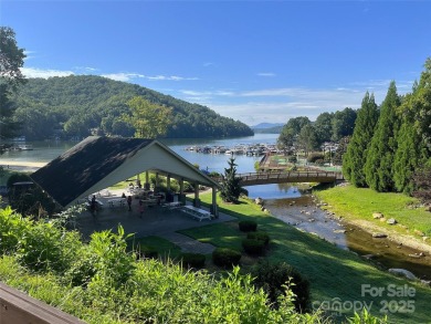 Enjoy stunning views of both Lake Lure and Rumbling Bald on Rumbling Bald Resort on Lake Lure in North Carolina - for sale on GolfHomes.com, golf home, golf lot