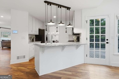 Welcome to 618 Wedgewood Drive, a refined golf-course residence on Canongate At Eagle Watch Golf Club in Georgia - for sale on GolfHomes.com, golf home, golf lot