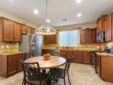 Located in Verrado's Main Street District with OWNED SOLAR & A on Verrado Golf Club  in Arizona - for sale on GolfHomes.com, golf home, golf lot