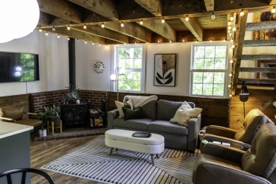 This beautifully reimagined Quechee Hollow end unit is turnkey! on Quechee Club in Vermont - for sale on GolfHomes.com, golf home, golf lot