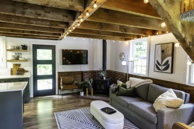 This beautifully reimagined Quechee Hollow end unit is turnkey! on Quechee Club in Vermont - for sale on GolfHomes.com, golf home, golf lot