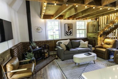 This beautifully reimagined Quechee Hollow end unit is turnkey! on Quechee Club in Vermont - for sale on GolfHomes.com, golf home, golf lot