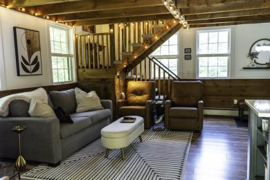 This beautifully reimagined Quechee Hollow end unit is turnkey! on Quechee Club in Vermont - for sale on GolfHomes.com, golf home, golf lot