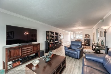 AN ABSOLUTE MUST SEE!! TOTALLY REMODELED PENTHOUSE UNIT. NEW CGI on Wynmoor Golf Course in Florida - for sale on GolfHomes.com, golf home, golf lot