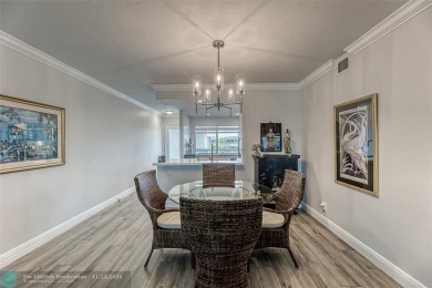 AN ABSOLUTE MUST SEE!! TOTALLY REMODELED PENTHOUSE UNIT. NEW CGI on Wynmoor Golf Course in Florida - for sale on GolfHomes.com, golf home, golf lot