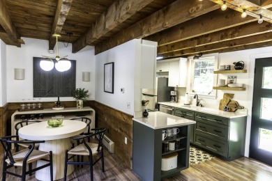 This beautifully reimagined Quechee Hollow end unit is turnkey! on Quechee Club in Vermont - for sale on GolfHomes.com, golf home, golf lot