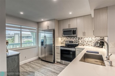 AN ABSOLUTE MUST SEE!! TOTALLY REMODELED PENTHOUSE UNIT. NEW CGI on Wynmoor Golf Course in Florida - for sale on GolfHomes.com, golf home, golf lot