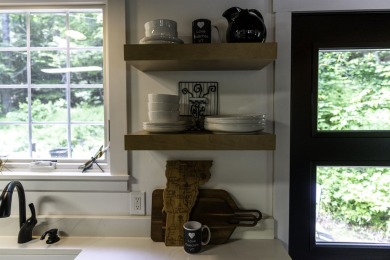 This beautifully reimagined Quechee Hollow end unit is turnkey! on Quechee Club in Vermont - for sale on GolfHomes.com, golf home, golf lot