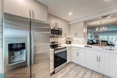 AN ABSOLUTE MUST SEE!! TOTALLY REMODELED PENTHOUSE UNIT. NEW CGI on Wynmoor Golf Course in Florida - for sale on GolfHomes.com, golf home, golf lot