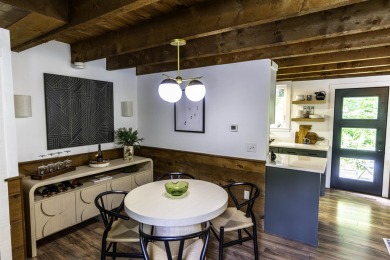 This beautifully reimagined Quechee Hollow end unit is turnkey! on Quechee Club in Vermont - for sale on GolfHomes.com, golf home, golf lot