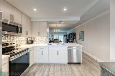 AN ABSOLUTE MUST SEE!! TOTALLY REMODELED PENTHOUSE UNIT. NEW CGI on Wynmoor Golf Course in Florida - for sale on GolfHomes.com, golf home, golf lot