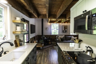 This beautifully reimagined Quechee Hollow end unit is turnkey! on Quechee Club in Vermont - for sale on GolfHomes.com, golf home, golf lot