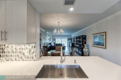 AN ABSOLUTE MUST SEE!! TOTALLY REMODELED PENTHOUSE UNIT. NEW CGI on Wynmoor Golf Course in Florida - for sale on GolfHomes.com, golf home, golf lot