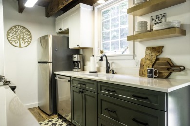 This beautifully reimagined Quechee Hollow end unit is turnkey! on Quechee Club in Vermont - for sale on GolfHomes.com, golf home, golf lot