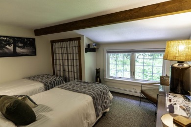 This beautifully reimagined Quechee Hollow end unit is turnkey! on Quechee Club in Vermont - for sale on GolfHomes.com, golf home, golf lot