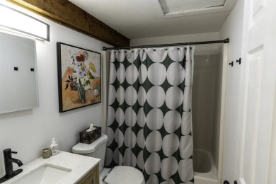 This beautifully reimagined Quechee Hollow end unit is turnkey! on Quechee Club in Vermont - for sale on GolfHomes.com, golf home, golf lot