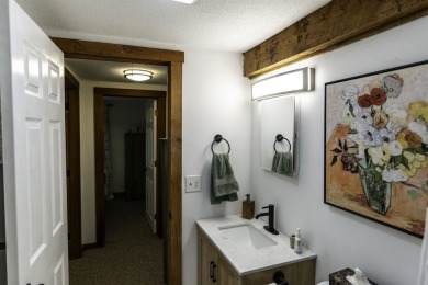 This beautifully reimagined Quechee Hollow end unit is turnkey! on Quechee Club in Vermont - for sale on GolfHomes.com, golf home, golf lot