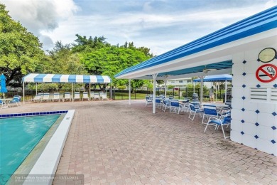 AN ABSOLUTE MUST SEE!! TOTALLY REMODELED PENTHOUSE UNIT. NEW CGI on Wynmoor Golf Course in Florida - for sale on GolfHomes.com, golf home, golf lot