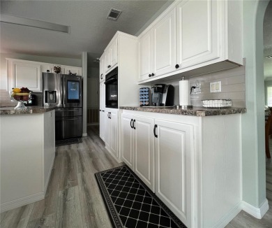 Exceptional Triple-Wide Home on Corner Lot in Pet-Friendly on Fairway Village Golf Course in Florida - for sale on GolfHomes.com, golf home, golf lot