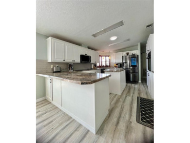 Exceptional Triple-Wide Home on Corner Lot in Pet-Friendly on Fairway Village Golf Course in Florida - for sale on GolfHomes.com, golf home, golf lot