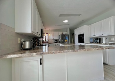 Exceptional Triple-Wide Home on Corner Lot in Pet-Friendly on Fairway Village Golf Course in Florida - for sale on GolfHomes.com, golf home, golf lot