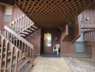 THIS UNFURNISHED 1 BEDROOM CONDO IS ON THE FIRST FLOOR AND on Diamondhead Country Club in Mississippi - for sale on GolfHomes.com, golf home, golf lot
