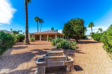 Expansive backyard with extended covered patio highlights this on Cottonwood Country Club in Arizona - for sale on GolfHomes.com, golf home, golf lot