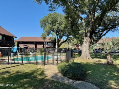 THIS UNFURNISHED 1 BEDROOM CONDO IS ON THE FIRST FLOOR AND on Diamondhead Country Club in Mississippi - for sale on GolfHomes.com, golf home, golf lot