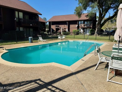 THIS UNFURNISHED 1 BEDROOM CONDO IS ON THE FIRST FLOOR AND on Diamondhead Country Club in Mississippi - for sale on GolfHomes.com, golf home, golf lot