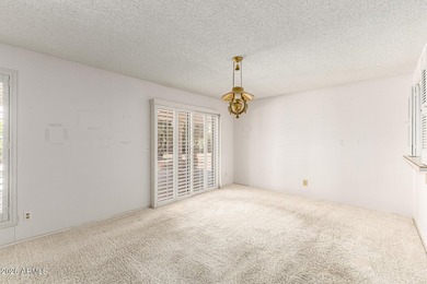 Expansive backyard with extended covered patio highlights this on Cottonwood Country Club in Arizona - for sale on GolfHomes.com, golf home, golf lot