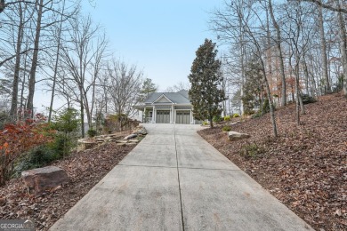 Welcome to 1259 Birch River Drive, a unique masterpiece nestled on Achasta Golf Club in Georgia - for sale on GolfHomes.com, golf home, golf lot
