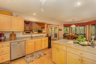Welcome to Whispering Woods, a stunning ranch-style home nestled on Alpine Lake Resort in West Virginia - for sale on GolfHomes.com, golf home, golf lot