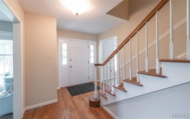 This stunning 2-story home offers 4 bedrooms, 2 full baths, and on Oak Meadow Country Club in Missouri - for sale on GolfHomes.com, golf home, golf lot