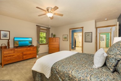 Welcome to Whispering Woods, a stunning ranch-style home nestled on Alpine Lake Resort in West Virginia - for sale on GolfHomes.com, golf home, golf lot