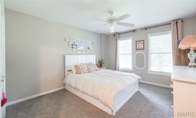 This stunning 2-story home offers 4 bedrooms, 2 full baths, and on Oak Meadow Country Club in Missouri - for sale on GolfHomes.com, golf home, golf lot