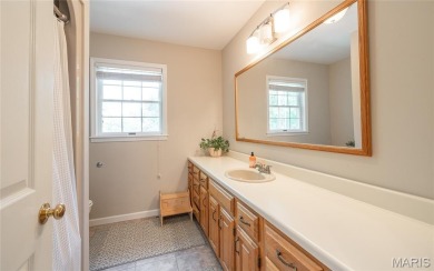 This stunning 2-story home offers 4 bedrooms, 2 full baths, and on Oak Meadow Country Club in Missouri - for sale on GolfHomes.com, golf home, golf lot
