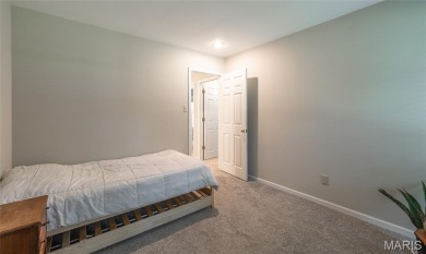 This stunning 2-story home offers 4 bedrooms, 2 full baths, and on Oak Meadow Country Club in Missouri - for sale on GolfHomes.com, golf home, golf lot