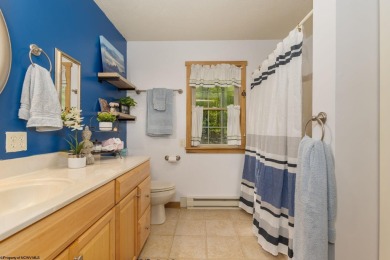 Welcome to Whispering Woods, a stunning ranch-style home nestled on Alpine Lake Resort in West Virginia - for sale on GolfHomes.com, golf home, golf lot