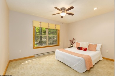 Welcome to Whispering Woods, a stunning ranch-style home nestled on Alpine Lake Resort in West Virginia - for sale on GolfHomes.com, golf home, golf lot