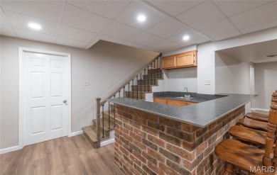 This stunning 2-story home offers 4 bedrooms, 2 full baths, and on Oak Meadow Country Club in Missouri - for sale on GolfHomes.com, golf home, golf lot