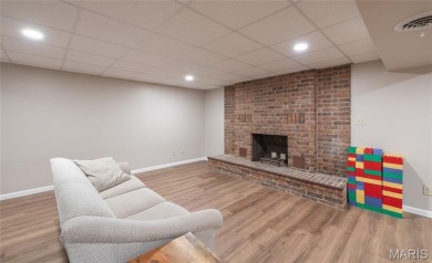This stunning 2-story home offers 4 bedrooms, 2 full baths, and on Oak Meadow Country Club in Missouri - for sale on GolfHomes.com, golf home, golf lot