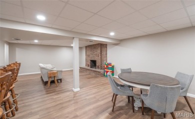 This stunning 2-story home offers 4 bedrooms, 2 full baths, and on Oak Meadow Country Club in Missouri - for sale on GolfHomes.com, golf home, golf lot
