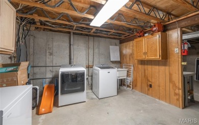 This stunning 2-story home offers 4 bedrooms, 2 full baths, and on Oak Meadow Country Club in Missouri - for sale on GolfHomes.com, golf home, golf lot