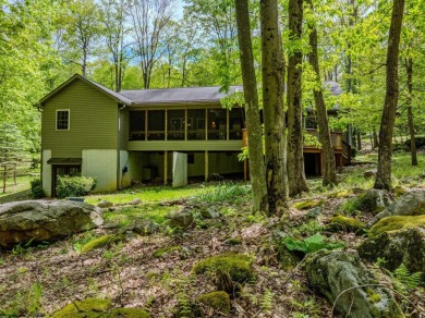 Welcome to Whispering Woods, a stunning ranch-style home nestled on Alpine Lake Resort in West Virginia - for sale on GolfHomes.com, golf home, golf lot