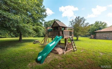 This stunning 2-story home offers 4 bedrooms, 2 full baths, and on Oak Meadow Country Club in Missouri - for sale on GolfHomes.com, golf home, golf lot